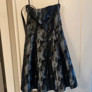 Strapless White House black market dress with belt. Dress has pockets!